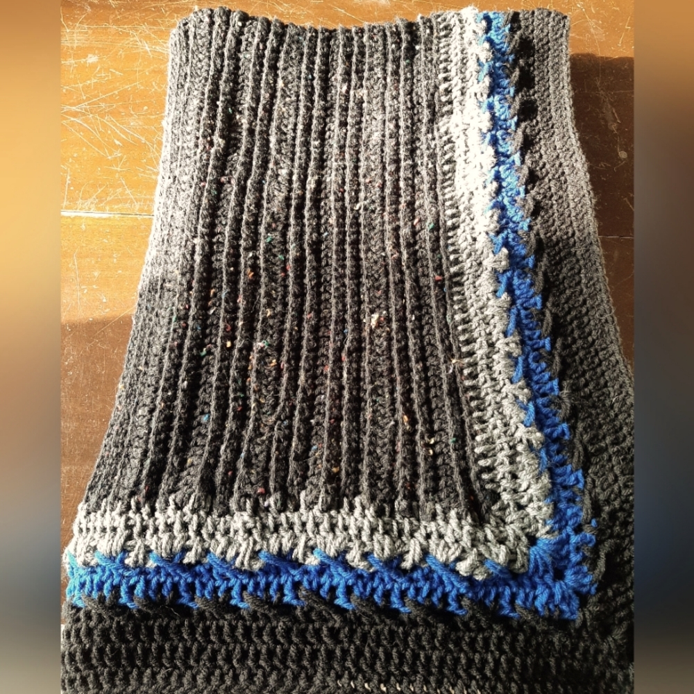 Hand crafted throw in multitone black, grey & blue